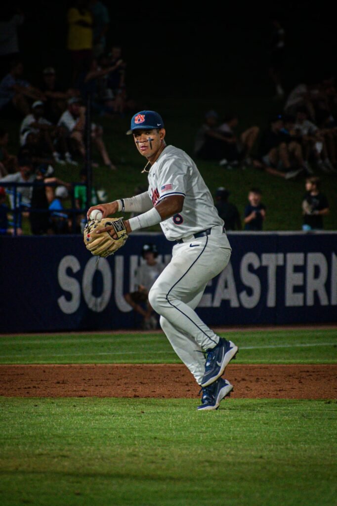 Infielder in navy fielding a ground ball