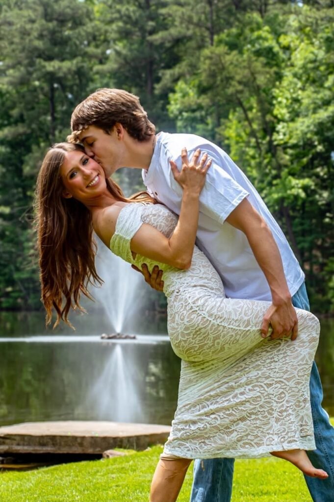 A dip and a kiss on the cheek in front of the pond fountain